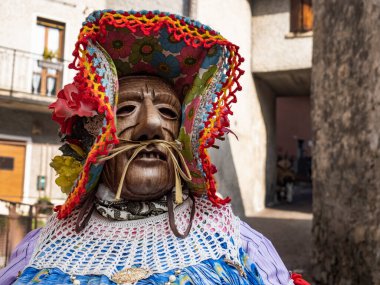 Shignano (Italy) 21/02/2023: The carnival of Schignano parade is one of the most famous traditional carnivals of north Italy with typical wood masks and performer that entertain the visitors .