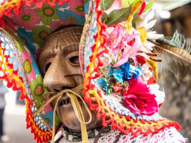Shignano (Italy) 21/02/2023: The carnival of Schignano parade is one of the most famous traditional carnivals of north Italy with typical wood masks and performer that entertain the visitors .
