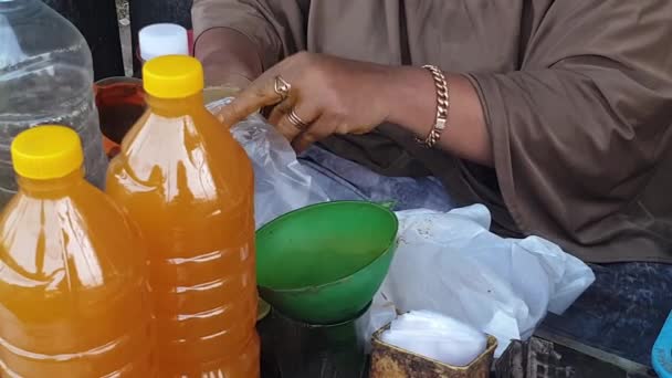 Close Seller Hand Bottles Jamu Indonesian Traditional Herbal Drink Medicine — Stock Video