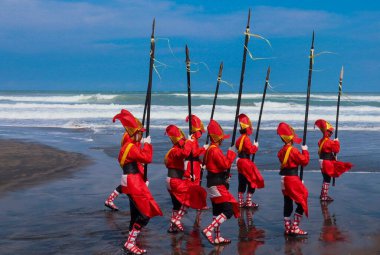 Parang Tritis Beach, Yogyakarta 7 June 2022: Annual Festival of the Sea Offering. The community around Parangtris beach holds a traditional celebration called Labuhan Bhakti Pisungsung Jaladri. clipart