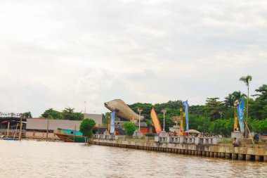 Palembang, Indonesia  Belido Fish Monument at Kuto Besak Fortress, Inaugurated by the Mayor of Palembang and PT Bukit Asam on 11 February 2018 clipart