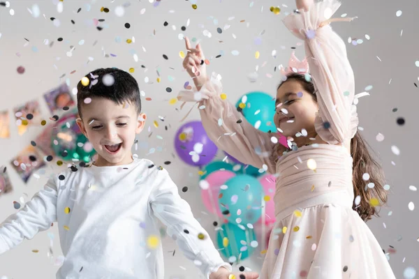 Smiling Children Outstretched Hands Falling Confetti Party Background Stock Fotó