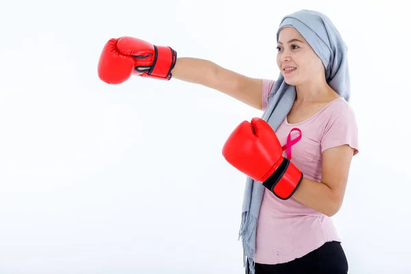 a asian woman disease mammary cancer patient fighting showing boxing gloves breast cancer awareness month isolated on white blank copy space studio background,healthcare,medicine concept