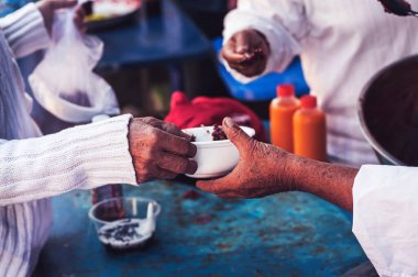 Volunteers come to provide free meals to the hungry poor : the concept of humanitarian assistance.