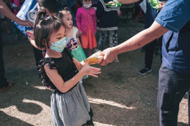 Chiang Mai, Thailand - January 14, 2023: Children's Day activities in Thailand in January of every year include snacks, food, dancing, and various rides.