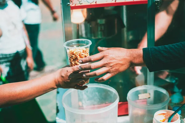 stock image Food Helping Humanity: Volunteers donate food to hungry people.