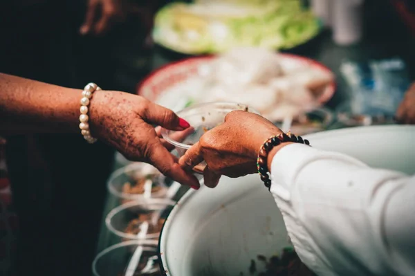 stock image Sharing food for the poor. Humanitarian aid through free feeding