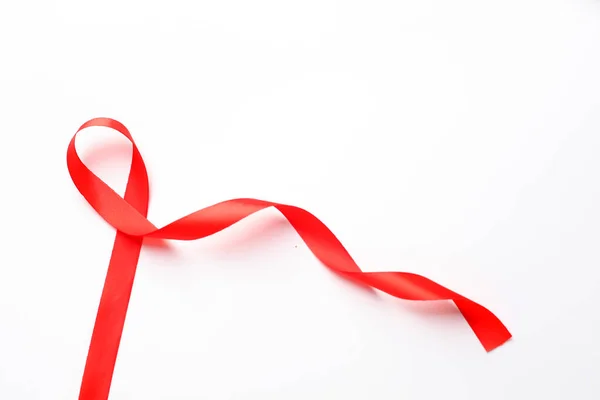 stock image Red ribbon over white background with copyspace. Aids day concept