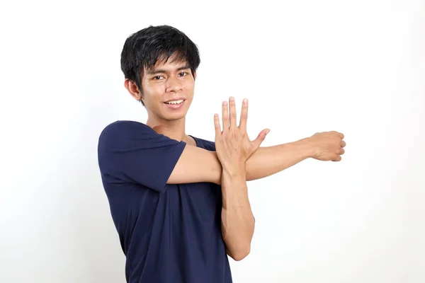 Ευτυχισμένος Νεαρός Ασιάτης Στέκεται Ενώ Τεντώνει Χέρι Του Απομονωμένα Λευκό — Φωτογραφία Αρχείου