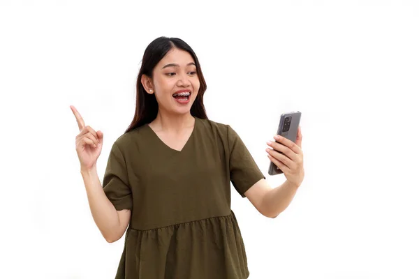 Excited Young Asian Woman Holding Cell Phone While Getting Idea — Stock Photo, Image