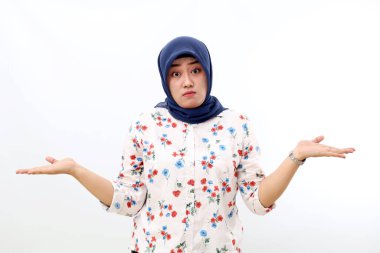 Confused asian muslim woman standing with asking hand gesture, Isolated on white background