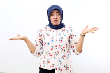 Worried asian muslim woman standing while making asking hand gesture, Isolated on white background