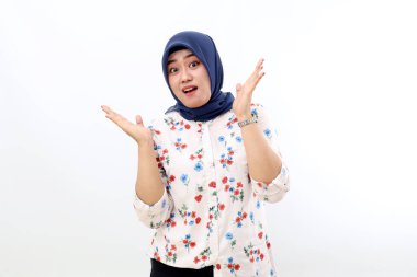 Cheerful asian muslim woman standing with amazed face expression. Isolated on white background