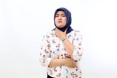 Asian muslim woman standing while touch her throat. Sick woman having sore throat. Isolated on white