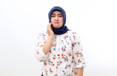Asian muslim woman suffering from tooth ache. Isolated on white background