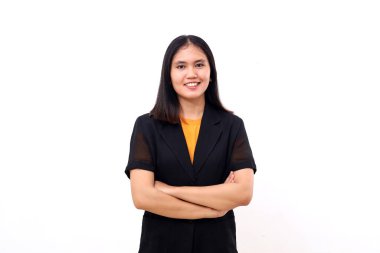 Portrait of happy young asian business woman standing with folded hands. Isolated on white