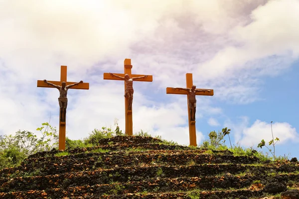 Three crosses standing on hill. Good Friday concept