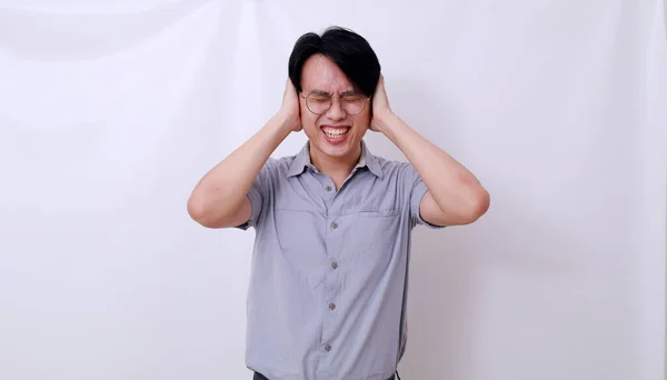 Stressed Asian Man Covering His Ears Loud Noises Isolated White — Stock Photo, Image