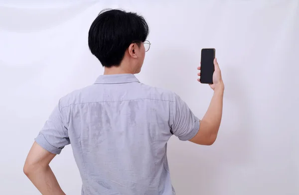 Back View Photo Asian Man Holding Cell Phone Isolated White — Stock Photo, Image