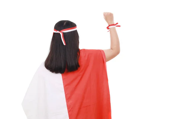 Bakifrån Kvinna Med Indonesisk Flagga Med Knuten Hand Isolerad Vit — Stockfoto