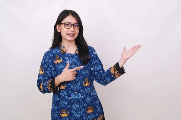 Happy Asian Female Batik Korpri Indonesian Traditional Uniform Presenting Sideways — Stock Photo, Image