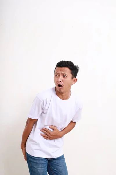 Asian Funny Man Holding His Stomach Butt While Farting Isolated — Stock fotografie
