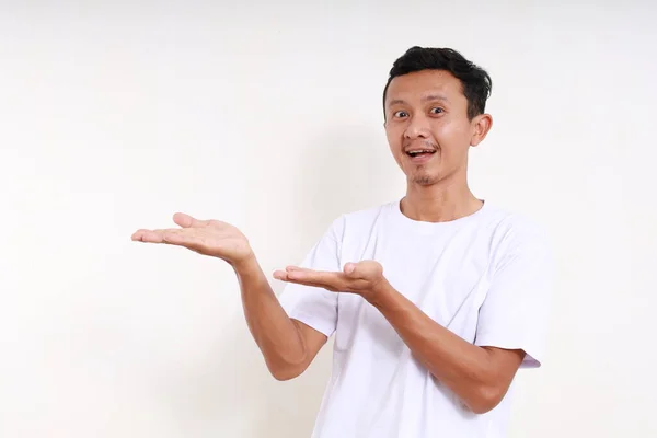 Asian Funny Man Standing While Presenting Something Him Isolated White — Stock Photo, Image