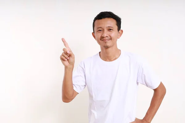 Happy Asian Funny Man Standing While Pointing Something Him Isolated — Stock Photo, Image