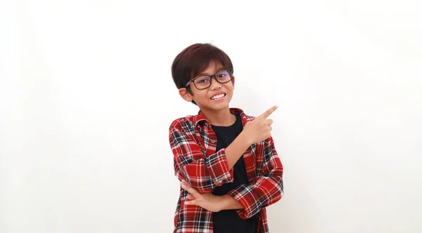 Happy Asian Boy Standing While Pointing Sideways Empty Space — Stok Foto