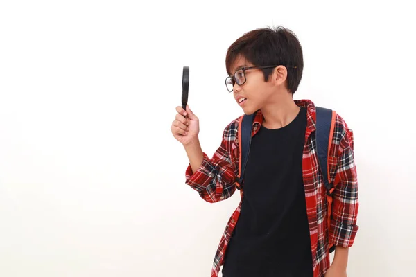 Happy Smart Asian Student Standing While Looking Magnifying Glass Isolated — Stock Photo, Image