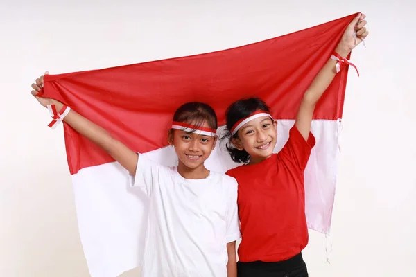 Dos Niñas Celebrando Día Independencia Indonesia Agosto Interior Aislado Sobre —  Fotos de Stock