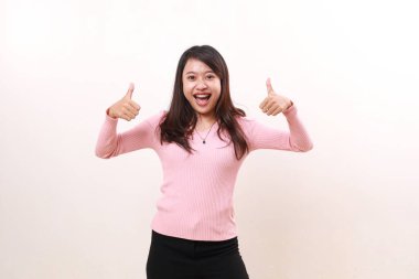 Happy excited satisfied young asian girl standing while showing thumbs up. Product advertisement and promotional concept. Isolated on white background