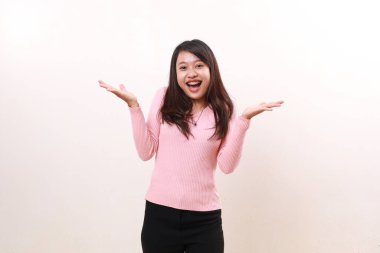Wow surprised amazed young asian girl standing while looking at the camera. Isolated on white background