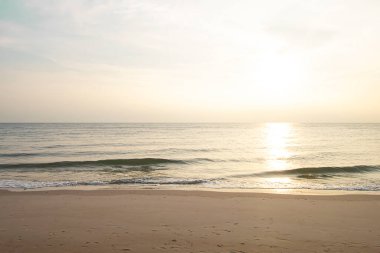 looking at the morning sunrise by the sea