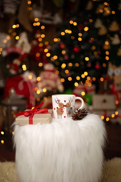 Christmas scene with beautiful background bokeh and standing Christmas mug. In studio