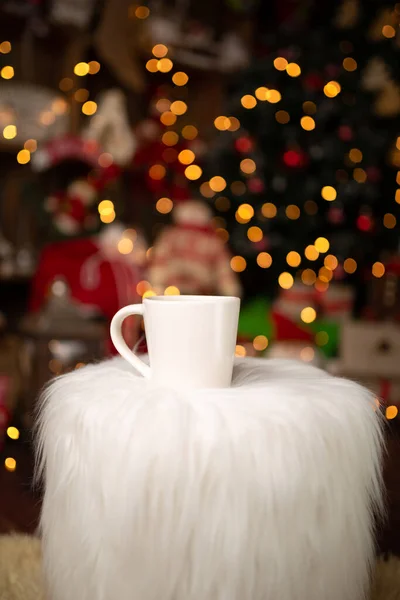 Christmas scene with beautiful background bokeh and standing Christmas mug. In studio