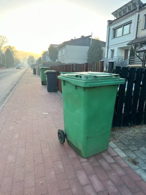 Plastic bucket prepared for collection by the garbage truck. Environmental Protection