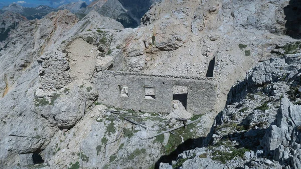An old, destroyed building standing near the trail in the Dolomites. Dolomites, Italy