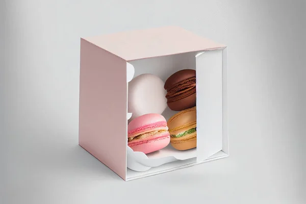 Colorful macaroons gift box. Sweet macarons present on white background