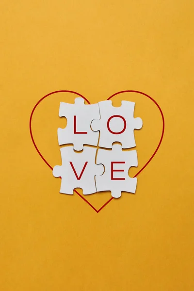 The word love on puzzles. A symbol of love and care