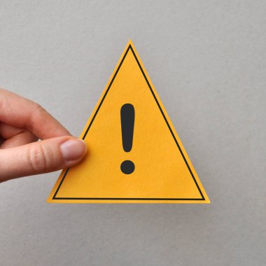 A yellow triangle with an exclamation mark. Please pay attention