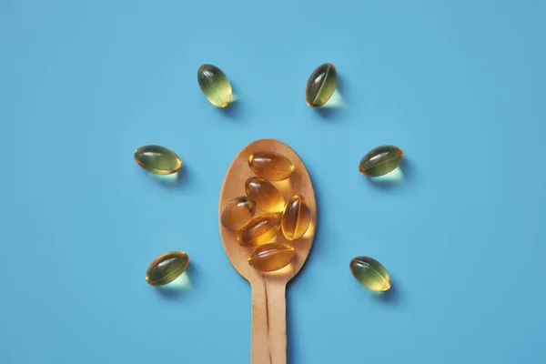 Yellow Capsules Wooden Spoon Vitamin — Stock Photo, Image