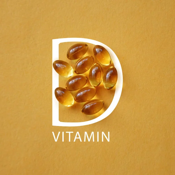 Vitamine Capsules Een Gele Achtergrond — Stockfoto