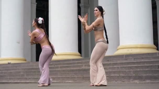 Wide Shot Two Women Spinning Shaking Hips Placing Hands Together — Stock Video