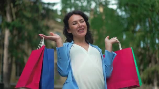 Satisfied Pregnant Lady Smiling Spinning Holding Shopping Bags Both Hands — Stock Video