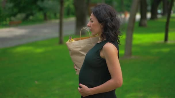 Live Camera Follows Confident Pregnant Lady Walking Grocery Bag Automobile — Stock Video