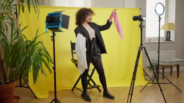 Wide Shot Beautiful Fashion Blogger Filming Video Camera Choosing Two — Vídeos de Stock