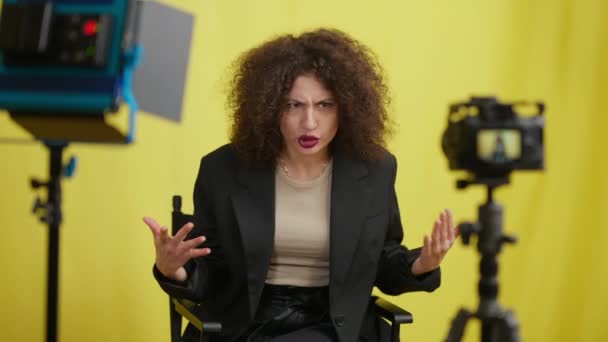 Beautiful Woman Talking Irritated Facial Expression Filming Video Blog Yellow — Stock Video