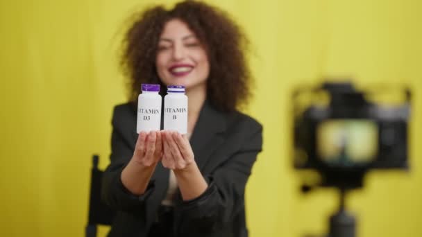 Smiling Blurred Caucasian Vlogger Advertising Vitamin Supplements Talking Filming Video — Vídeo de stock