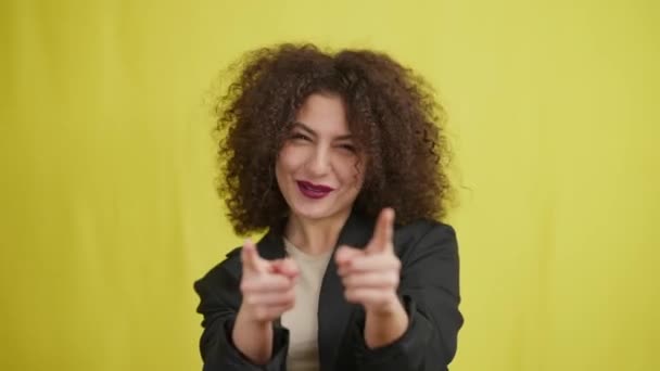 Portrait Joyful Woman Pointing Camera Posing Yellow Background Happy Cheerful — Vídeos de Stock